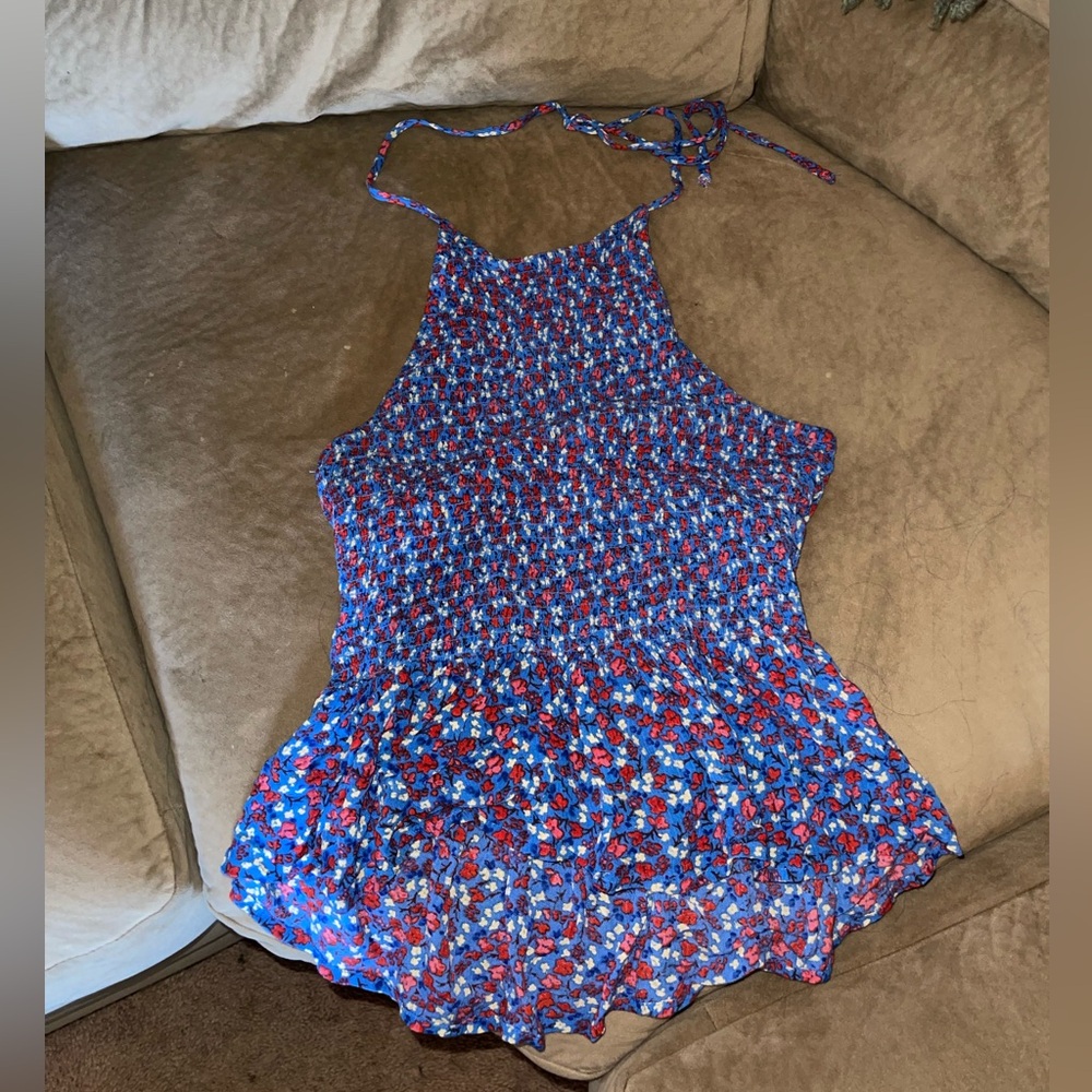 Kinda cropped tank that ties around neck, top half of back is backless